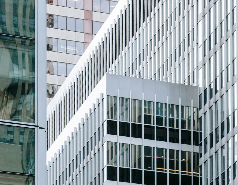Contemporary white and glass buildings viewed from the street